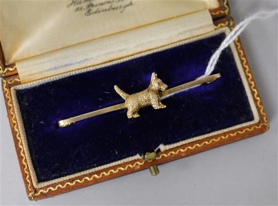 An early 20th century 9ct gold Scottie dog bar brooch.